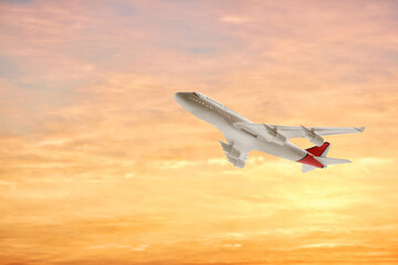 Fototapeta na wymiar Airplane flying in sky at sunset. Air transportation