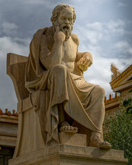 Socrates the ancient Greek philosopher sitting in deep thought statue, Athens Greece