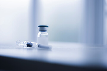 Vaccine coronavirus deverlopment vial dose flu shot drug needle syringe,medical concept vaccination hypodermic injection treatment disease care hospital prevention immunization illness disease.