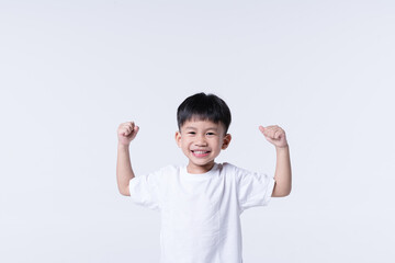 Healthy Asian boy with strong gesture