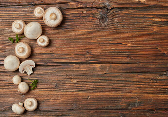 Fototapeta na wymiar Edible mushrooms on a wooden table