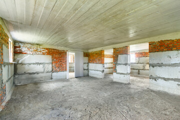 The corner view of the unfinished basement in a new residential house under construction with the...