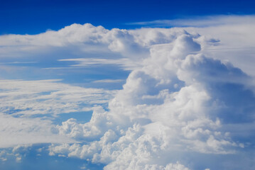 Obraz na płótnie Canvas Clouds and sky from airplane window view