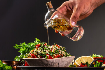 Tabbouleh salad. Traditional middle eastern or arab dish. Levantine vegetarian salad with parsley,...