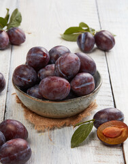 Fresh organic plums with leafs