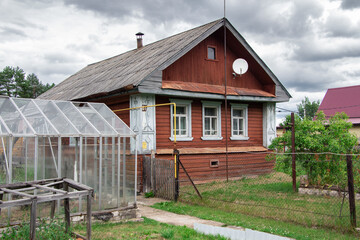 Fototapeta na wymiar Image of aged wooden house, facade view