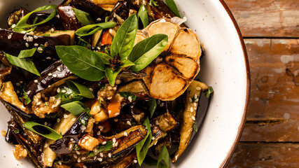 Vegan food. snack stewed eggplant salad in Korean style with green onion, closeup, Food recipe background