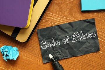 Business concept about Code Of Ethics with phrase on the page.