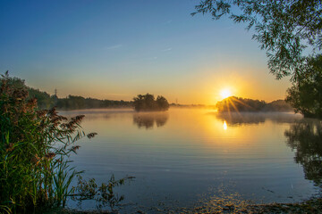 Fototapeta na wymiar Manvers Lake Misty Morning Sunrise