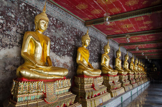Veranda of Gild Buddha Sculptures at Wat Suthat, Bangkok of Thailand.