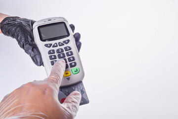 Payment terminal. Hand in glove. Safe shopping concept