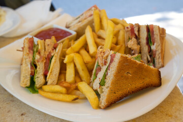 A club sandwich (clubhouse sandwich) is a sandwich of toasted bread, sliced cooked chicken or...
