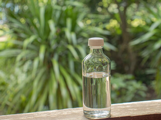 alcohol bottle  green glass background