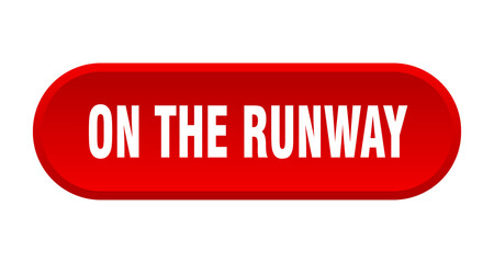 on the runway button. rounded sign on white background