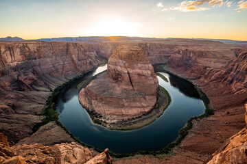 Nice View of Horseshoe bend sunset times during summer season . One of the most famous nature places in Arizona and locate near the town name Page , Arizona , United States of America