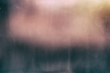 Distressed blurred abstract vintage background dirty pink pastel spots with a dark stripe and streaks of dried water with traces of stains and grain, scratches, dirt.