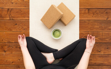 Cup of matcha in a meantime during yoga practise