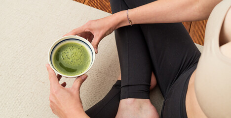 Cup of matcha in a meantime during yoga practise