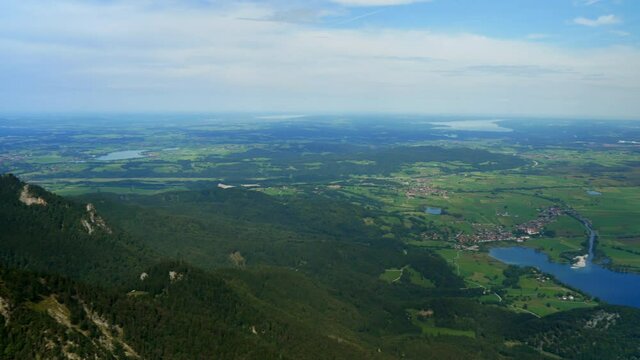 Panorama shot from the top of Herzogstand Mountain Peak to Munich,Germany. Wide shot showing Staffelsee, Kochelsee, Ammersee and Starnbergersee in background. Austrian German Border.