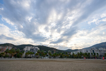 Fototapeta na wymiar The beautiful city of Vlore, with its gorgeous mountains and cloudy blue sky.