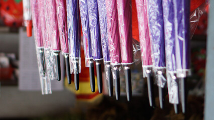 Colorful umbrella hangers in the store