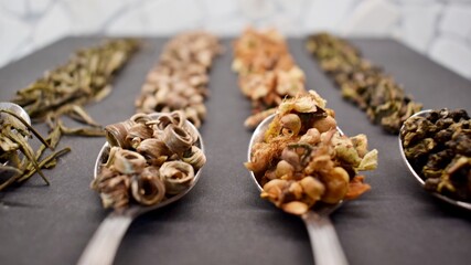 different types of tea on a spoon