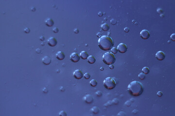 Fantastic oil drops on ble-purple background