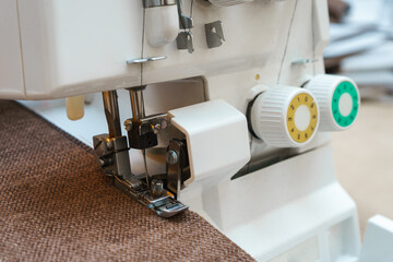 Overlock sewing machine in process. Professional equipment.
