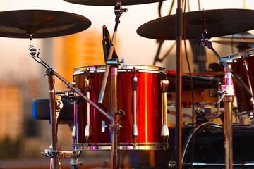 A close up photo of red drums on the stage