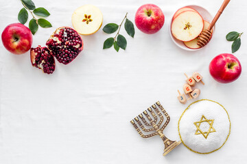 Rosh Hashana jewish new year concept. Apple and honey on the table, top view
