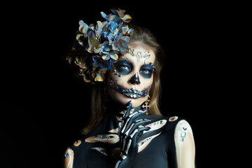 Halloween beauty portrait of a skeleton woman of death, the makeup on the face. Girl death Halloween costume. Day of The Dead. Charming and dangerous Calavera Catrina