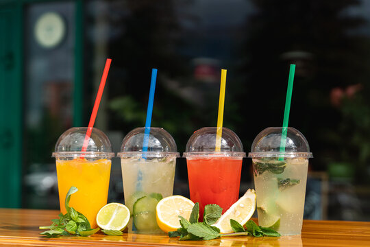 Assortment Of Seasonal Summer Cocktails In Plastic Glasses To Go