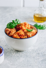 Popular Baked Cauliflower with barbeque sauce. Buffalo barbecue Cauliflower Wings. Vegan Food concept.