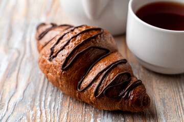 Close up of crispy chocolate croissant, magazine photo