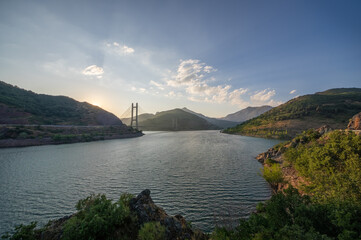 Reservoir and cable-stayed bridge of Barrios de Luna during a sunset, Leon, Spain.