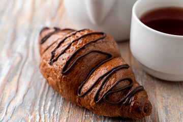 Close up of crispy chocolate croissant, magazine photo