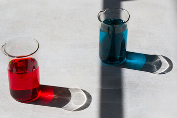 Matrix film choice colors in laboratory glassware with red and blue color reagents