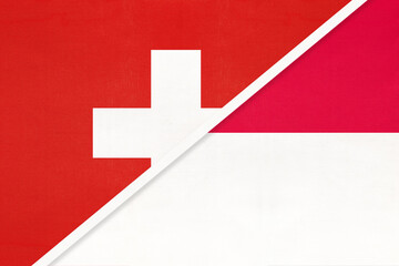 Fototapeta premium Switzerland and Monaco, symbol of national flags from textile. Championship between two countries.