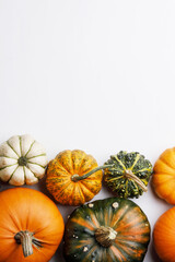 Colorful pumpkins on white