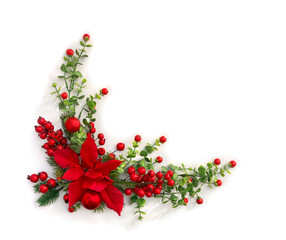 Christmas decoration. Flower of red poinsettia, branch christmas tree, red berries on white background with space for text. Top view, flat lay