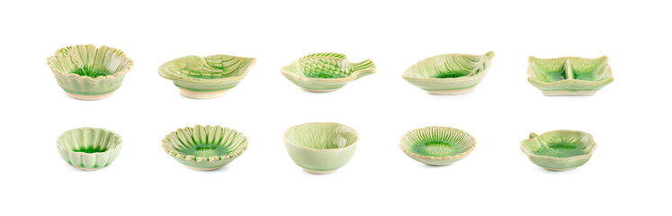Green handmade pottery cup on white background. clipping path