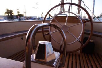 Boat deck and compass at sunrise