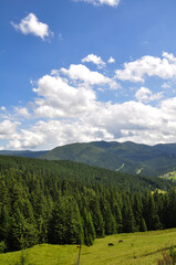 beautiful mountain landscape with colorful bright clouds and sunshine in the sky, fantastic outdoor background