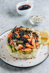 Spicy shrimp sushi stacks with layers of sushi rice, cucumbers and avocado spicy shrimp and furikake