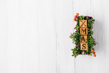 Text "Xmas" made of wooden cubes.  Ideas for eco friendly decor.