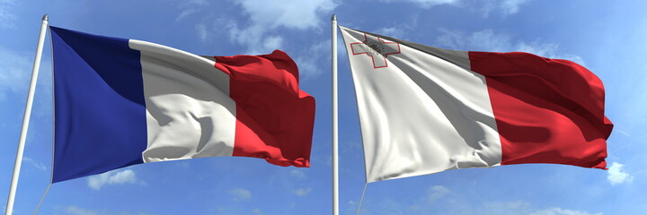 Flags of France and Malta on flagpoles. 3d rendering