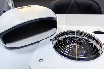 UV lamp for drying varnish on the desktop of a manicurist with a built-in fan