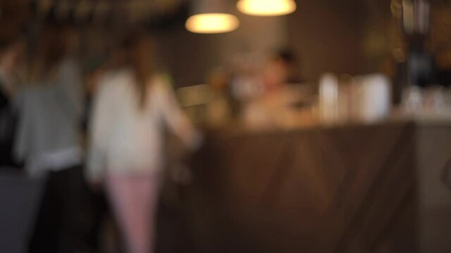 Breakfast, lunch, cafe, restaurant, coffee shop. Blurred background inserting text. Everyday life full swing. Visitors weekend cafe. Have good time. The queue is in front cashier, waiting for an order