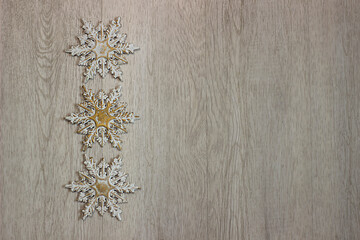 christmas snowflakes on wooden background