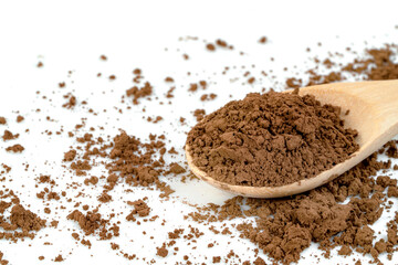 Cocoa powder with wooden spoon isolated on white background